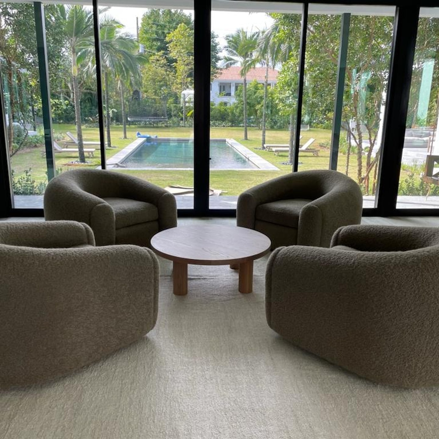 Custom swivel barrel chairs by Andinos Custom Designs installed in a South Florida home overlooking the pool